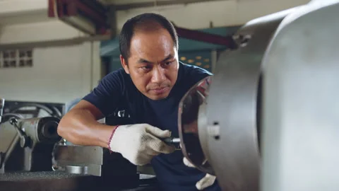 Technician asia worker using vernier caliper measure detail of workpiece Stock Footage 204055029