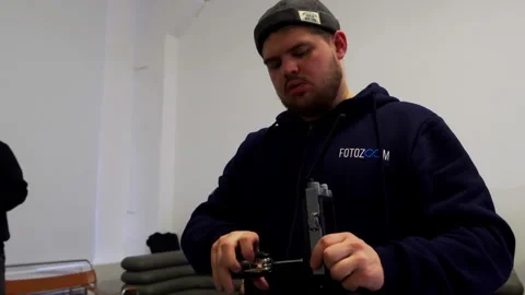 Technician assembles camera motion control system in studio Stock Footage 303060869