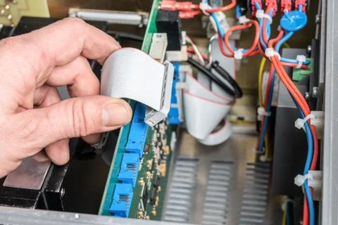Technician assembles components of a measuring device Stock Photos