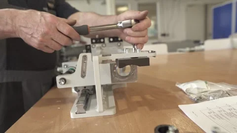 Technician Assembling Mechanical Component with Hand Tool Stock Footage 331371283