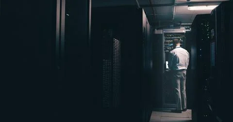 Technician, back and engineer with man in server room for cybersecurity, network 写真素材