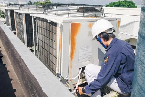 Technician is checking air conditioner Stock Photos