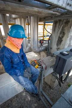 Technician to checking electrical cable Stock-Fotos