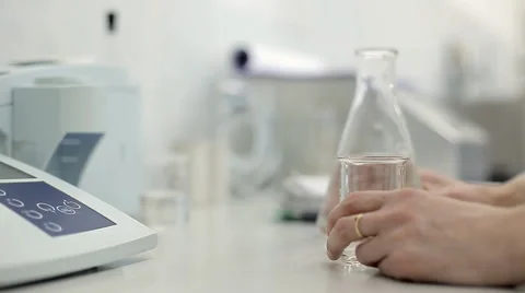 A technician is checking the quality of water Stock Footage 63014626