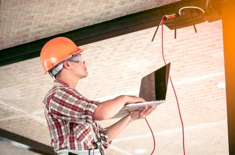 The technician is checking the signal. After installing the Internet in the b Stock Photos