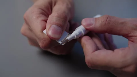 Technician cleaning adapter from memory card contacts using specialized solution Stock Footage 319772560