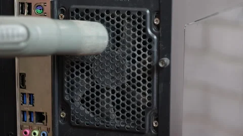 Technician cleaning dusty computer fan with vacuum cleaner Stock Footage 332172910