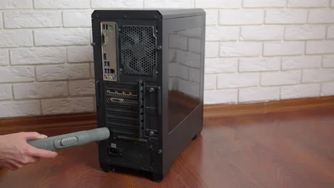 Technician cleaning pc tower case with vacuum cleaner 스톡 동영상 334787581