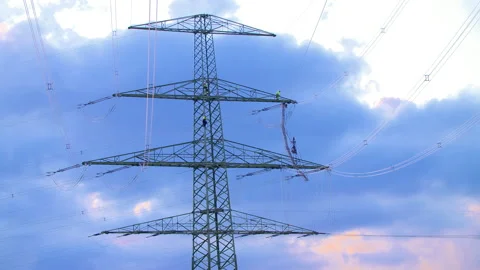 A technician climbs down a power pole Stock Footage 163077705