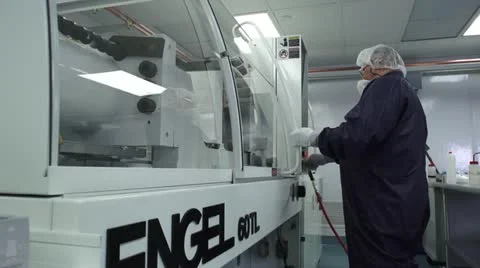 Technician Closes machine door in cleanroom Stock Footage 10895645