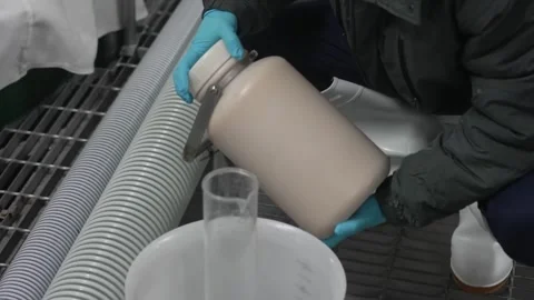 Technician Collecting a Sake Sample With Gloved Hands Vidéo 340010484