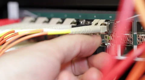 Technician connecting fiber network cable Stock Footage 53063983