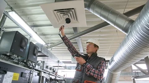 Technician controlling air quality of heating equipment Stock Footage 51577656