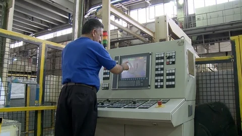 Technician controls molding machine inside Khodro car factory, Tehran, Iran Stock Footage 119157744