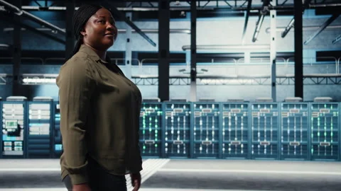 Technician in data center overseeing large scale IT gear Stock Footage 317125874