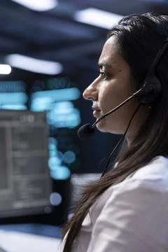 Technician in data center working on computer, providing technical support Foto stock
