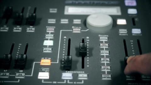 Technician Decreasing Studio Illumination on Video Controller Regie 库存影片 307414751