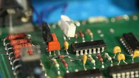 Technician diagnoses the circuit board components. Stock Footage 72580629