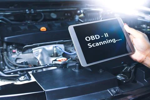 Technician diagnostics of code failure with OBD2 scanner technology Stock-Fotos