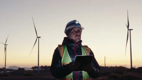 Technician with Digital Tablet Performing Inspection of Wind Turbines Stock-Footage 237218618