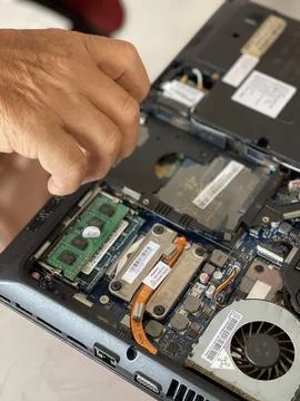 Technician Disassembling Laptop Hardware Components For Inspection Stock Photos