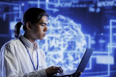 Technician does AI systems checkup Stock Photos