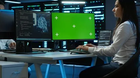 Technician doing checkup on green screen server hub PC, using AI tech Stock Photos