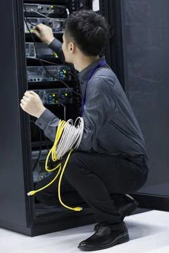 Technician doing maintenance in computer room Beijing China Copyright: xLa... Foto stock