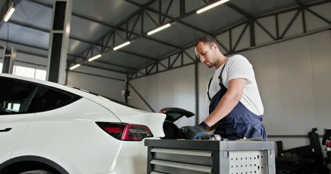 Technician Engages In Troubleshooting EV Car Battery Cell Module Stock Footage 277216347