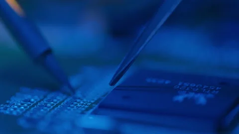 Technician engineer developer is soldering iron pcb microcircuit electronic Stock Footage 195972252