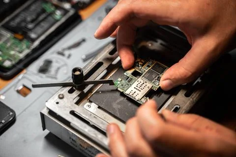 Technician engineer mount electronic device on iron board on the table Stock Photos