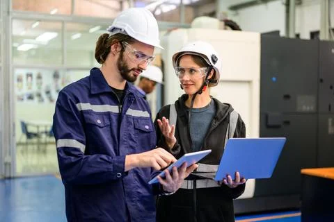 Technician engineer team checking and repairing part of automatic machine 写真素材