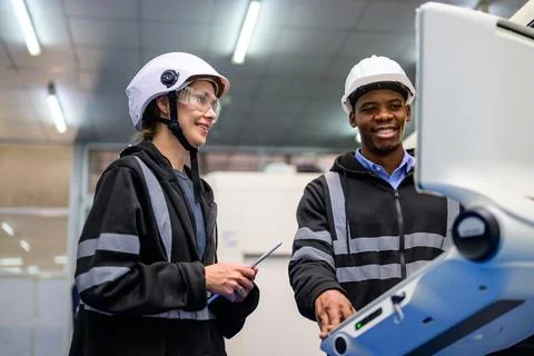 Technician engineer team checking and repairing part of automatic machine Stock Photos