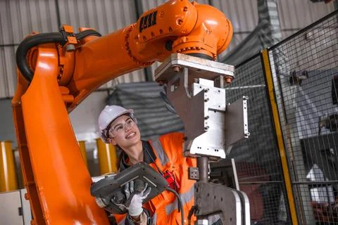 Technician engineer women test control operate inspection robot arm install.. Foto stock