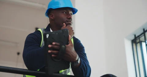 Technician, engineering and black man with tablet for thinking, renovation or Stock Footage 341466691