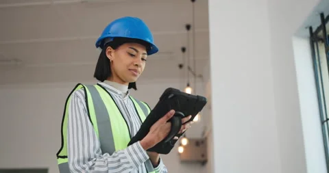 Technician, engineering and woman with tablet for inspection, renovation project Stock Footage 341466361