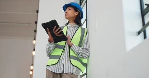 Technician, engineering and woman with tablet for schedule, renovation and Stock Footage 341466371