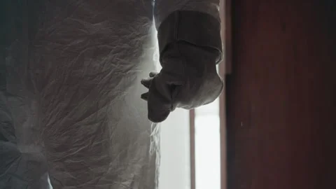 Technician examines icy surface details. Closeup of protective gear and frozen Stock Footage 346470640