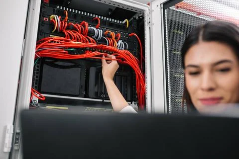  Technician examining server in server room with laptop Portrait of techni... Stock-Fotos