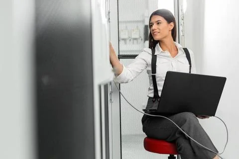  Technician examining server in server room with laptop Portrait of techni... Stock-Fotos