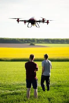 Technician farmer use wifi computer control agriculture drone on sugarcane fi Stock Photos