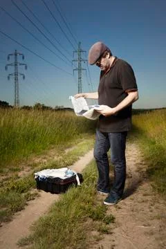 Technician in fields opening DNA free protective equipment Stock Photos