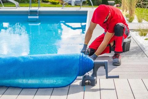 Technician Finishing Pool Deck Installation Stock Photos