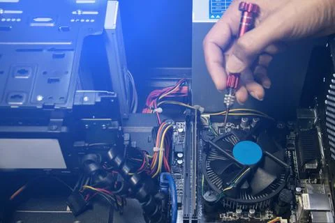 The technician is fixing the computer. Stock Photos