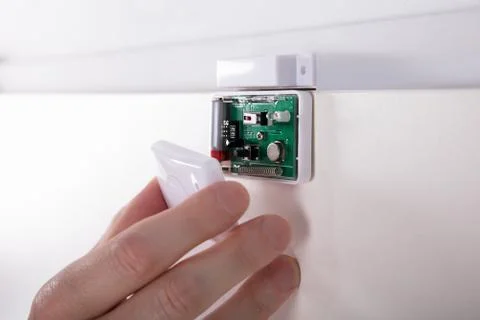 Technician Fixing Security System Door Sensor Stock Photos