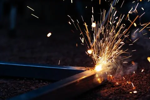 Technician focus on welding process on spark light with equipment. Stock Photos