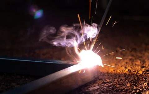 Technician focus on welding process on spark light with equipment. Stock Photos