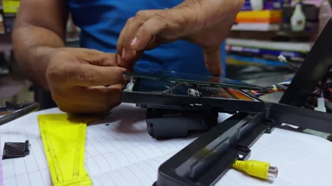 Technician gets repair tablet display at workshop Stock Footage 299785907