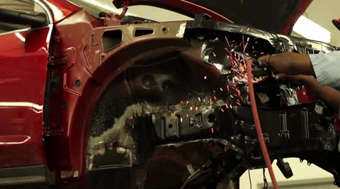 Technician grinds front apron assembly on a vehicle 스톡 동영상 25879044