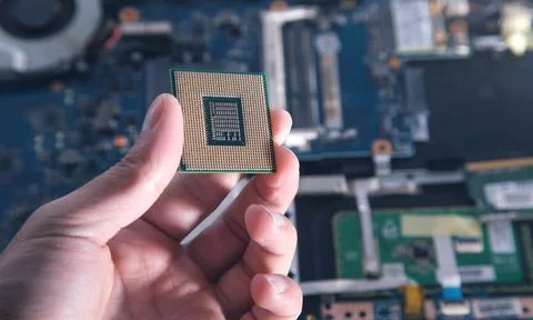 Technician hand holding cpu processor of pc. 스톡 사진